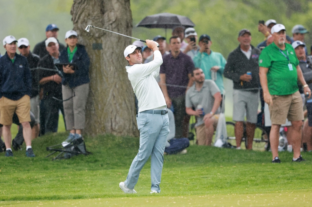 Scottie Scheffler of the United States plays a second shot on the 18th hole during the second round of the 2023 PGA Championship at Oak Hill Country Club on May 19, 2023 in Rochester, New York. (Photo by Warren Little / GETTY IMAGES NORTH AMERICA / Getty Images via AFP)
