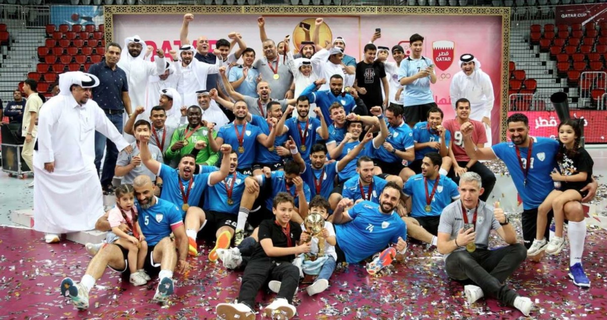 Al Wakrah players and officials celebrate after their Qatar Cup triumph yesterday. PIC: Amr Diab