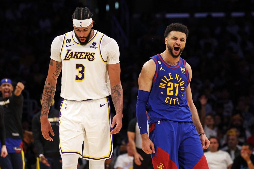 Jamal Murray #27 of the Denver Nuggets reacts to a play in front of Anthony Davis #3 of the Los Angeles Lakers during the second quarter in game three of the Western Conference Finals at Crypto.com Arena on May 20, 2023 in Los Angeles, California.  Harry How/ AFP
 