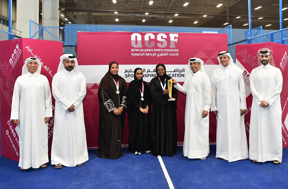 Dr. Ibrahim bin Saleh Al Nuaimi, Undersecretary of the Ministry of Education and Higher Education honouring a winning student at the ceremony. 