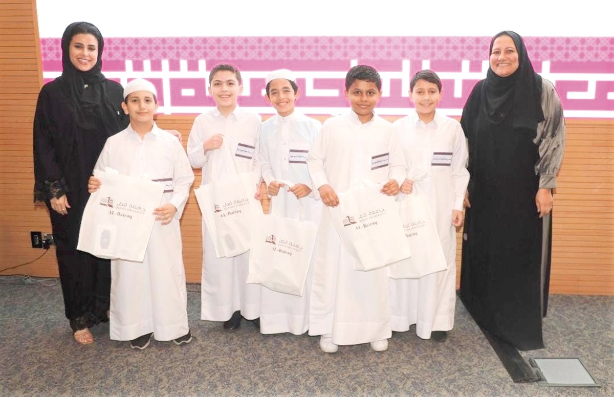 The winning schoolchildren with officials at the concluding ceremony. 