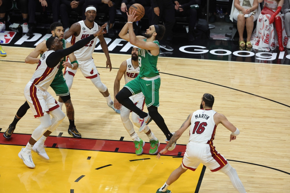 Derrick White #9 of the Boston Celtics drives to the basket ahead of Bam Adebayo #13 of the Miami Heat during the fourth quarter in game six of the Eastern Conference Finals at Kaseya Center on May 27, 2023 in Miami, Florida. Megan Briggs/Getty Images/AFP 