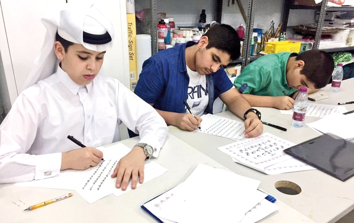 Participants during an Arabic calligraphy workshop.