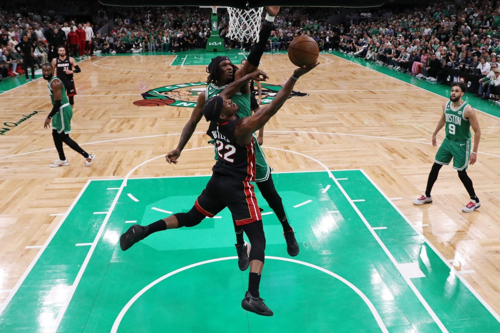 Jimmy Butler #22 of the Miami Heat shoots the ball against Robert Williams III #44 of the Boston Celtics during the third quarter in game seven of the Eastern Conference Finals at TD Garden on May 29, 2023 in Boston, Massachusetts. Maddie Meyer/Getty Images/AFP 