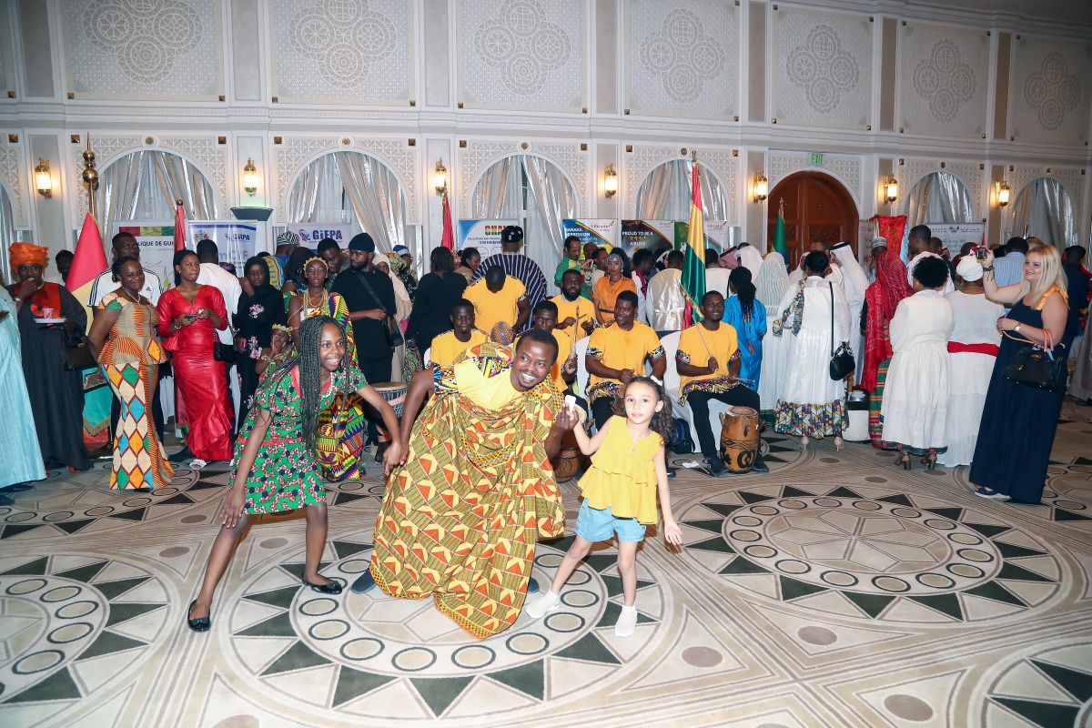 Ghana dance troupe performs traditional dances with guests during the Africa Day event.