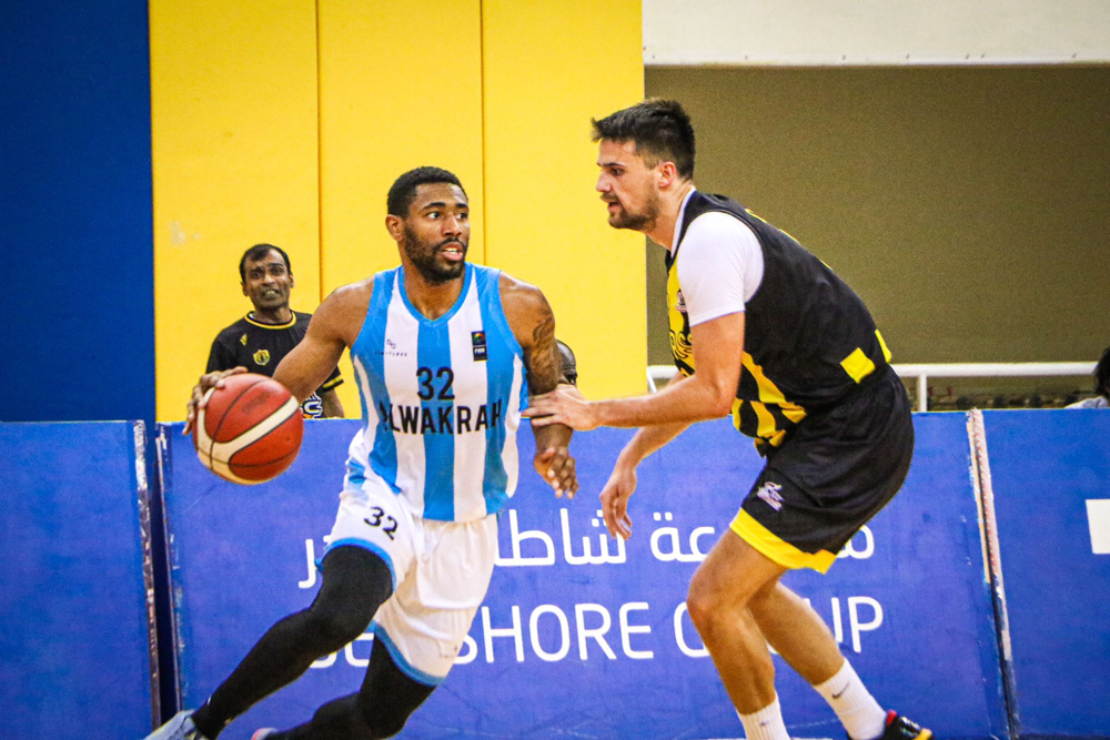 Al Wakrah's Brandon Lloyd Spearman drives against a Qatar SC player.