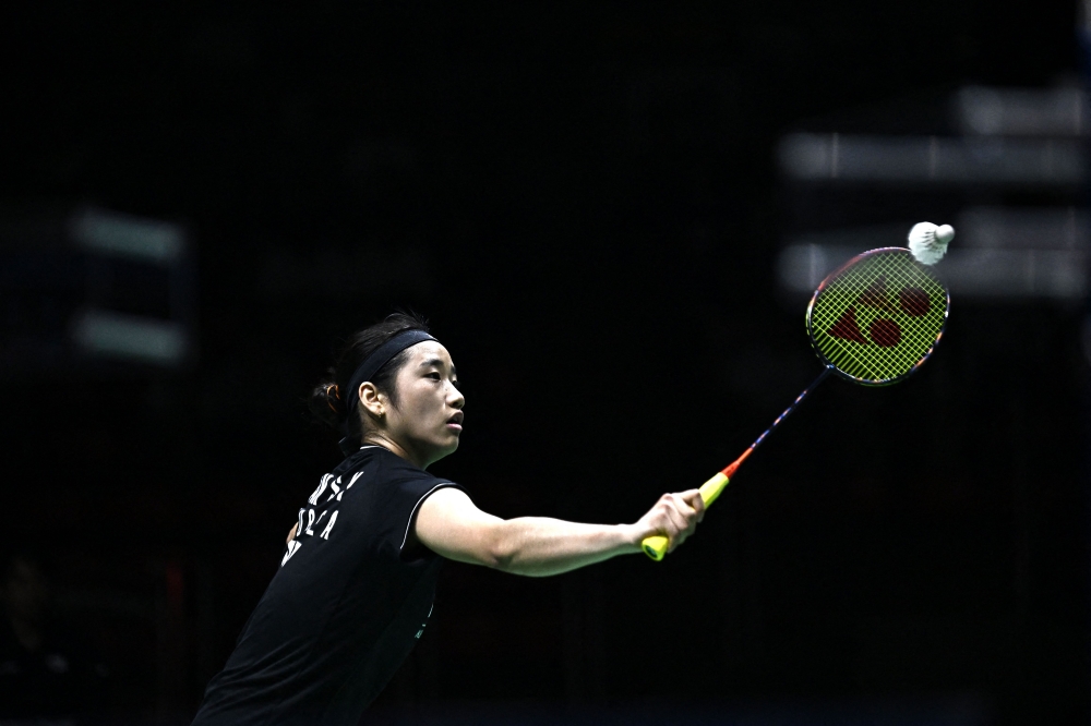 South Korea's An Se-young hits a return against China's He Bingjiao during their women's singles final match at the 2023 Thailand Open badminton tournament in Bangkok on June 4, 2023. Photo by Lillian SUWANRUMPHA / AFP