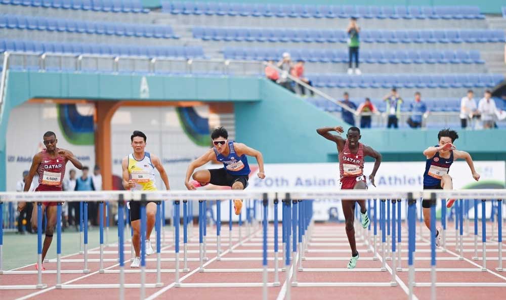 Qatar’s Oumar Dawood Abakar (second right) in action during the 110m hurdles final yesterday.  