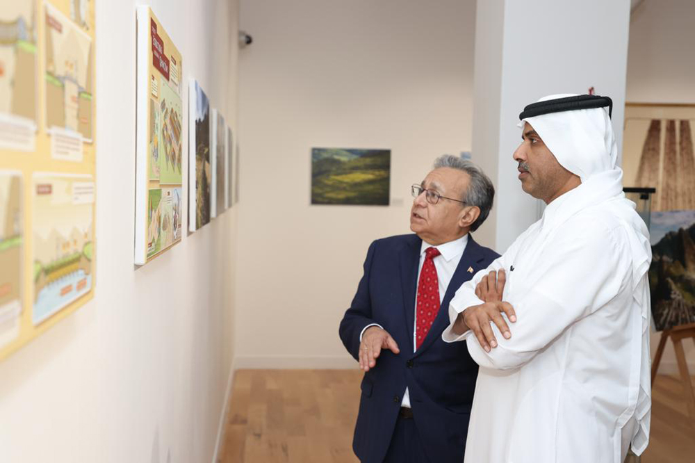 Katara Deputy Director-General of the Foundation and Director of the Human Resources Department, Saif Al Dosari and Peru Ambassador to Qatar H E Jose Benzaquin Perea touring the exhibition.