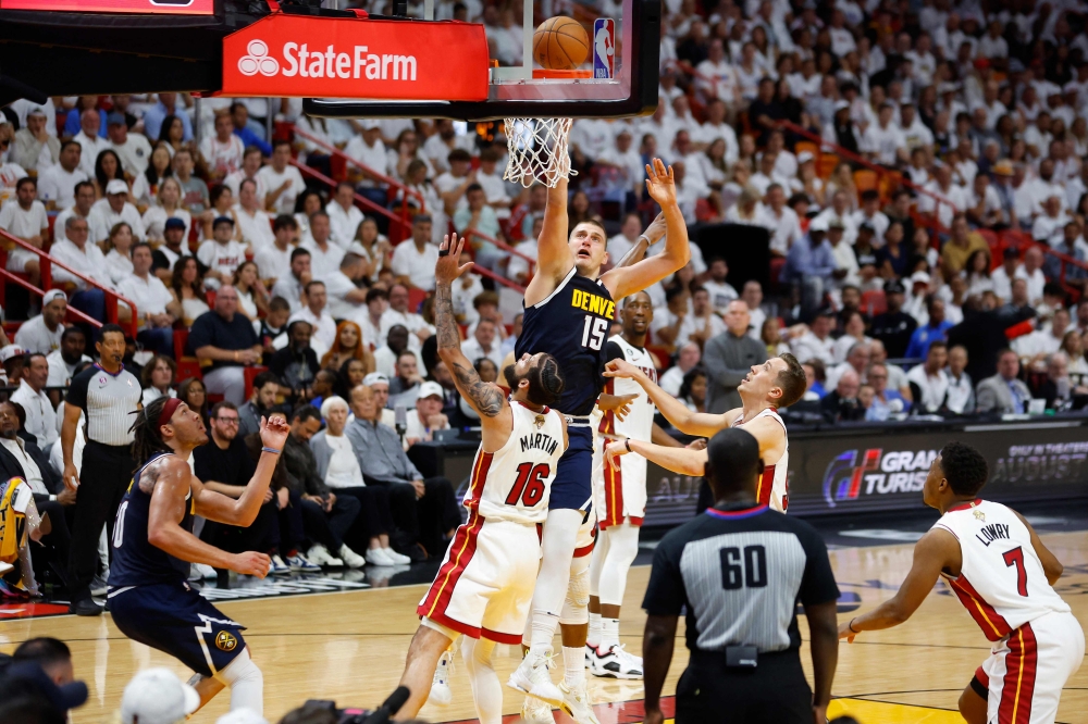 Nikola Jokic #15 of the Denver Nuggets shoots over Caleb Martin #16 of the Miami Heat during the second quarter in Game Four of the 2023 NBA Finals at Kaseya Center on June 09, 2023 in Miami, Florida. Photo by Mike Ehrmann / AFP