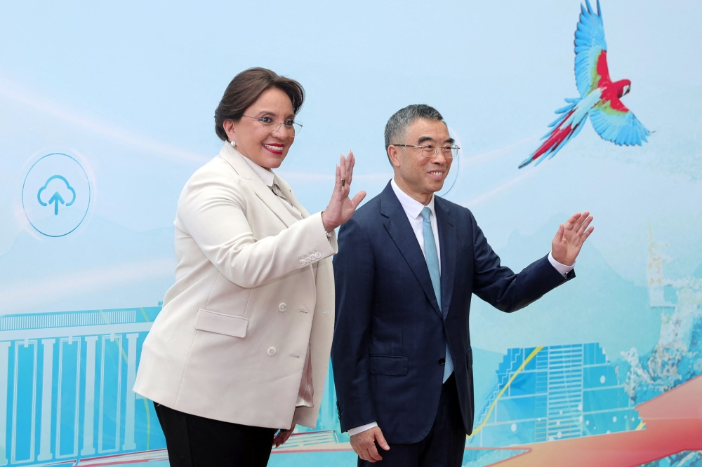 Honduran President Xiomara Castro (L) poses with Chairman of Huawei's Board of Directors Liang Hua, during her visit to Huawei Research Center in Shanghai on June 10, 2023. (Photo by CNS / AFP) 