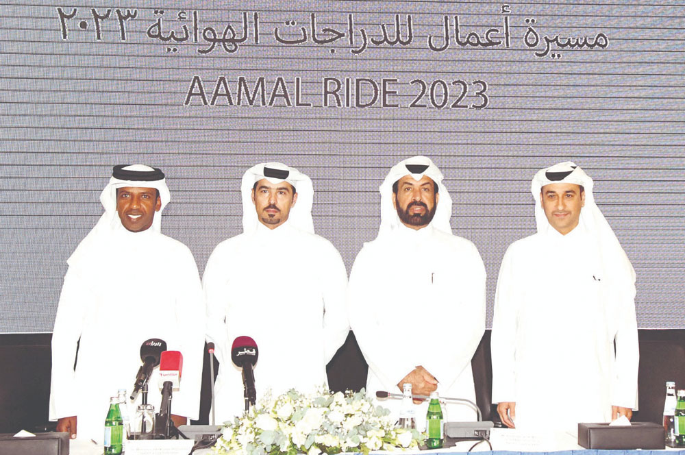 From left: Secretary-General of the Cycling and Triathlon Federation, Eng. Thani Al Zarraa; President of the Qatar Cycling and Triathlon Federation Dr. Mohamed bin Jaham Al Kuwari; CEO of Aamal Company Rashid bin Ali Al Mansouri and another official during the press conference yesterday.