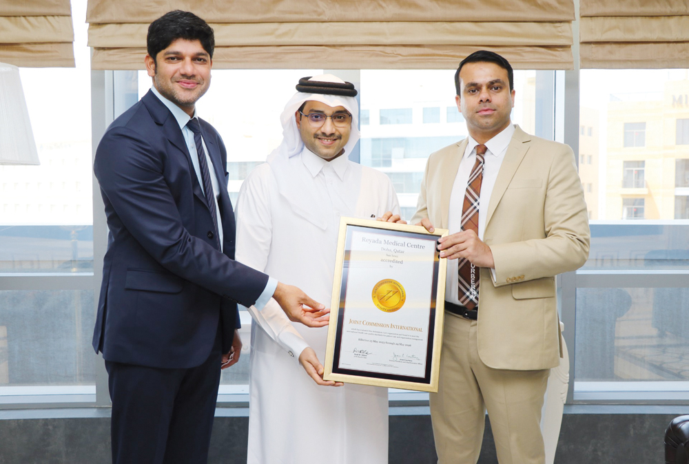 Chairman of Reyada Healthcare Sheikh Jassim bin Mohamed Hamad Al Thani (centre); Managing Director of Reyada Healthcare Jamsheer Hamza (right) and Executive Director of Reyada Medical Centre, Dr. Abdul Kalam (left) with the Joint Commission International accreditation certificate.