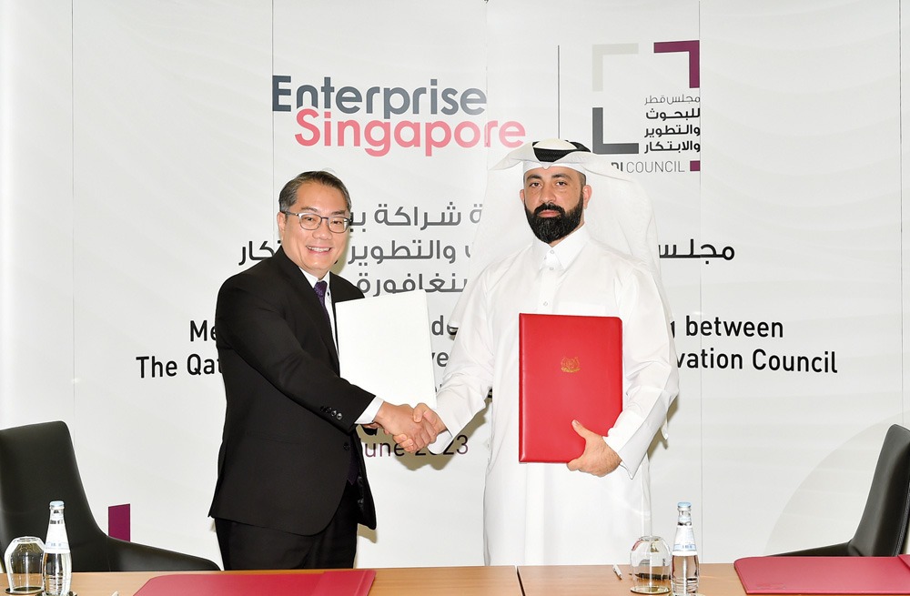 File photo: QRDI Secretary General Eng. Omar Al Ansari (right) and Deputy Chief Executive Officer (Global Markets) of Enterprise Singapore Tan Soon Kim during the signing of MoU. PIC: ABDUL BASIT.

