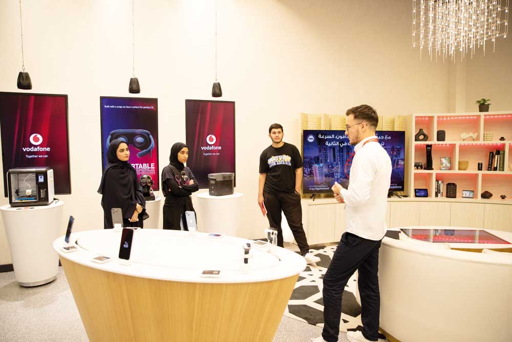 Vodafone staff attend to visitors during the event.