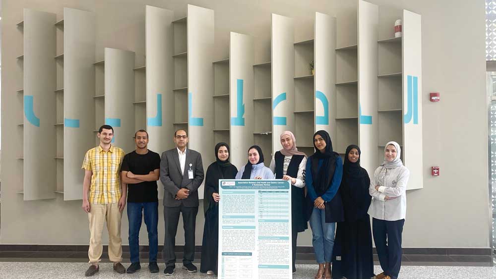 The winning team of the 5th Youth Research Forum with their research posters.