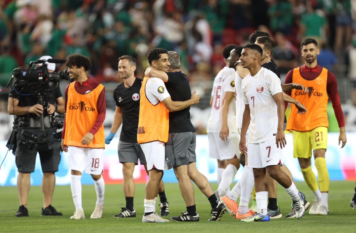 Qatar's players and officials celebrate after their 1-0 win over Mexico at Levi's Stadium in Santa Clara, yesterday.