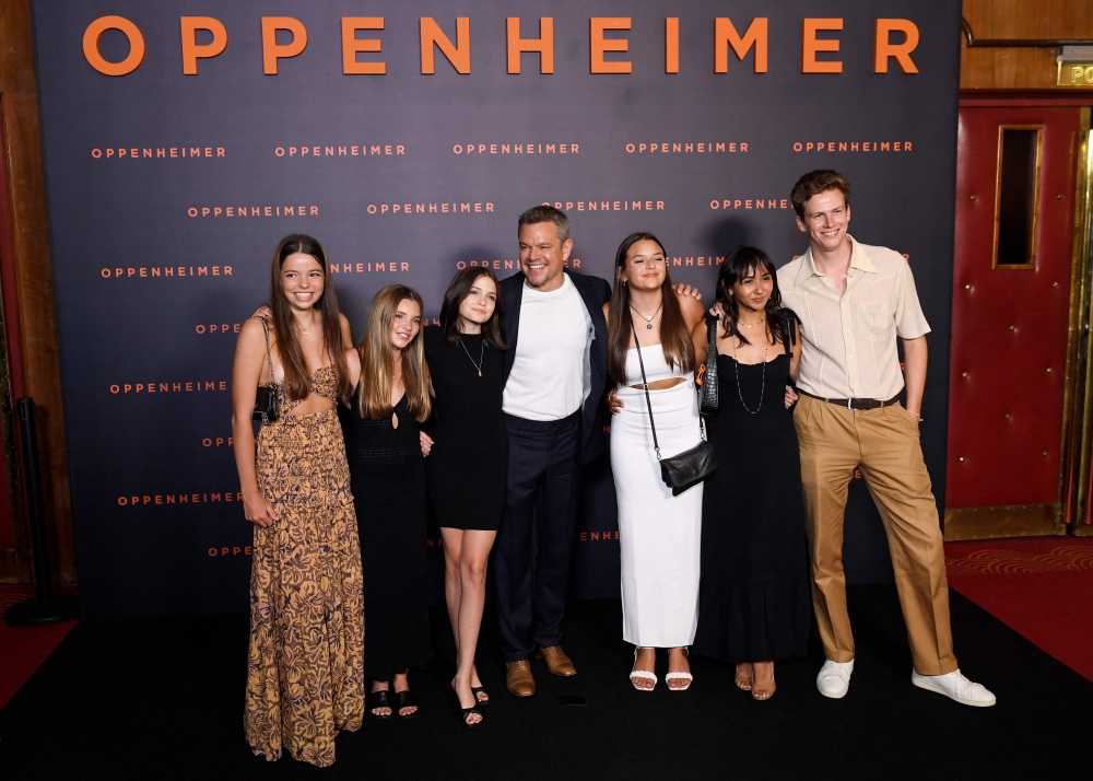 US actor Matt Damon (C) poses with his daughters Stella Damon, Gia Damon and Alexia Barroso upon their arrival for the 