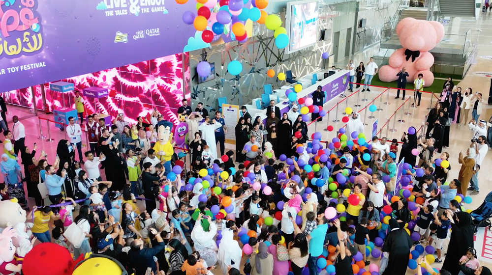 People enjoying the dropping of balloons during the opening of Qatar Toy Festival at the DECC.