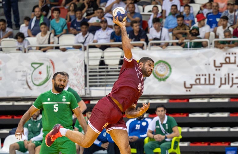 A Qatari player attempts to score during final against Saudi Arabia.