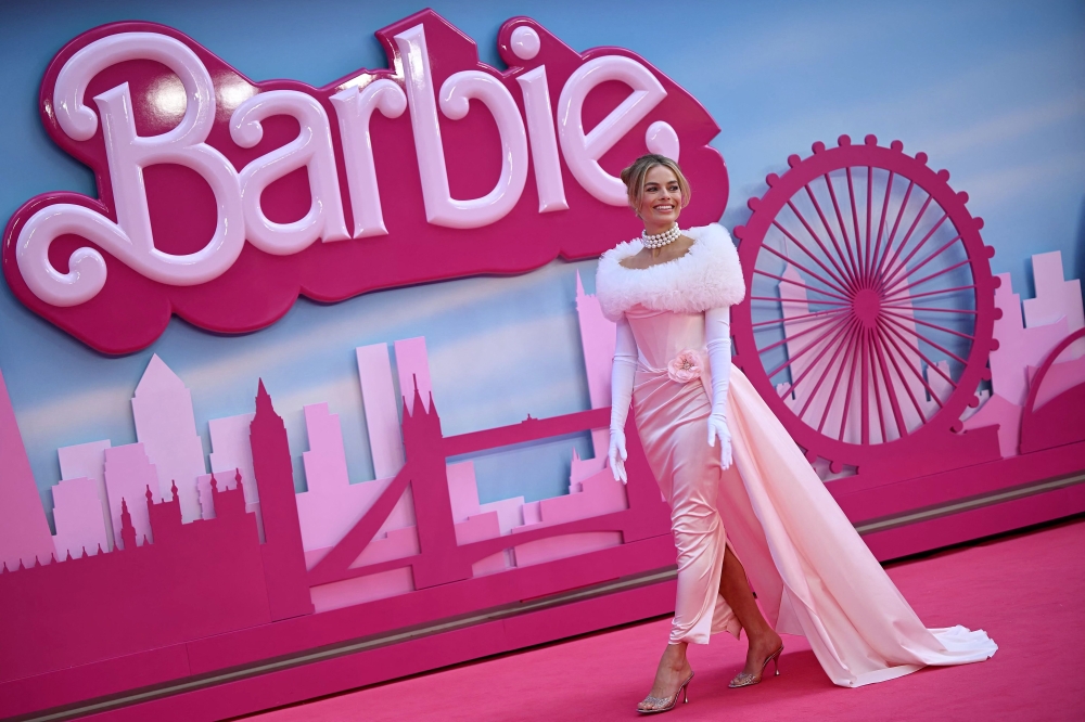 Australian actress Margot Robbie poses on the pink carpet upon arrival for the European premiere of 