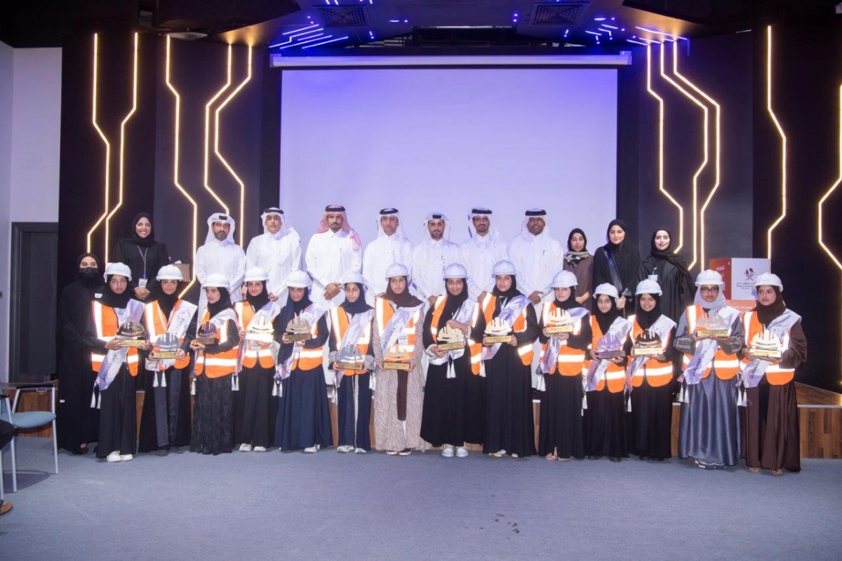 Ashghal officials with a group of students participating in the “Future Engineer” programme.