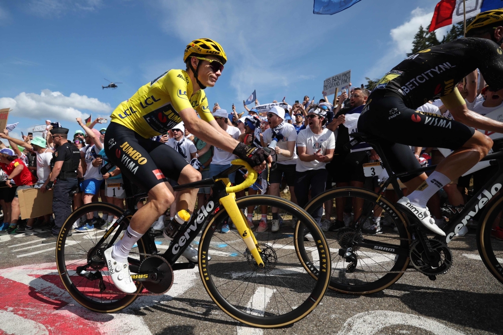 Jumbo-Visma's Danish rider Jonas Vingegaard wearing the overall leader's yellow jersey cycles in the ascent of the Petit Ballon in the final kilometres of the 20th stage of the 110th edition of the Tour de France cycling race 133 km between Belfort and Le Markstein Fellering, in Eastern France, on July 22, 2023. Photo by Thomas SAMSON / AFP