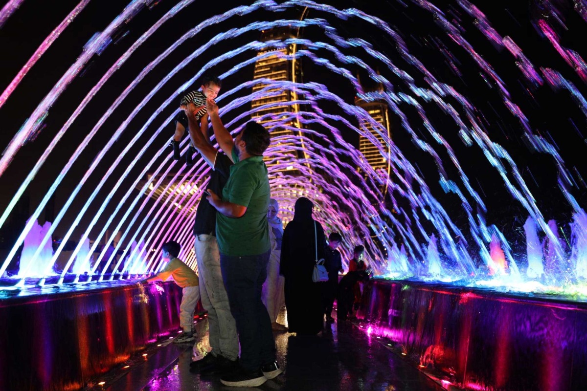 Residents enjoying their weekend at Lusail Marina Promenade's fountain on Friday, August 4, 2023. Pic: Salim Matramkot / The Peninsula 