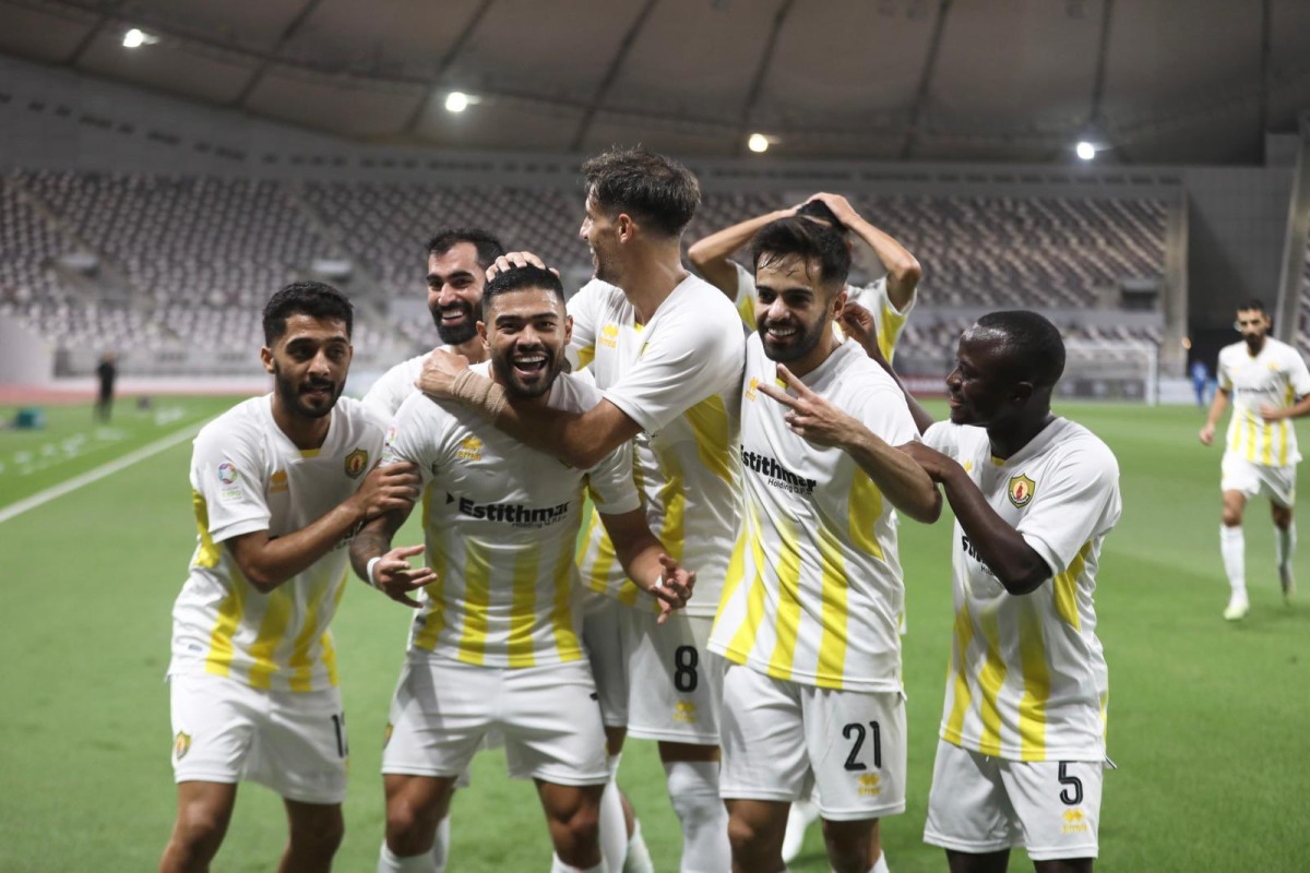 Qatar SC players celebrate after Bruno Tababa scored their opening goal.