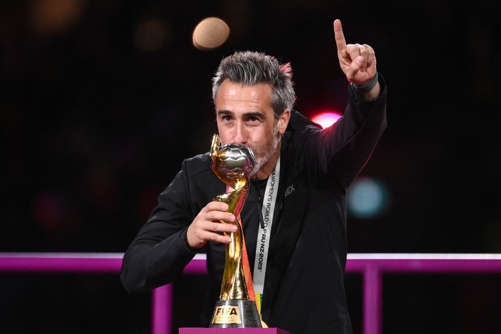 Spain's coach Jorge Vilda kisses the trophy after his team's victory in the Australia and New Zealand 2023 Women's World Cup final football match on August 20, 2023. (Photo by Franck Fife / AFP)