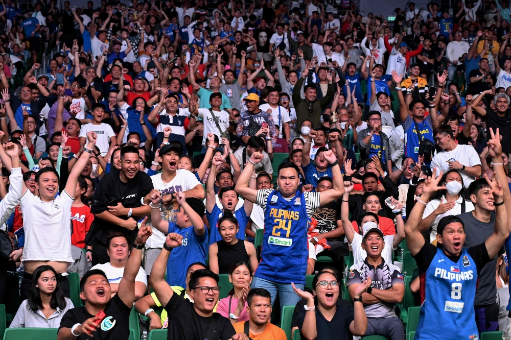 Fans react during the FIBA Basketball World Cup group A match between Philippines and Dominican Republic at Philippine Arena in Bocaue on August 25, 2023. (Photo by Jam Sta Rosa / AFP)