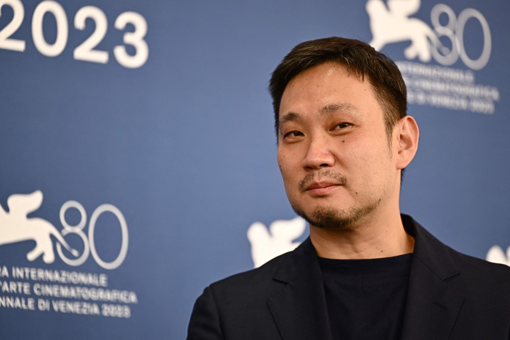 Japanese director Ryusuke Hamaguchi poses during the photocall of the movie 