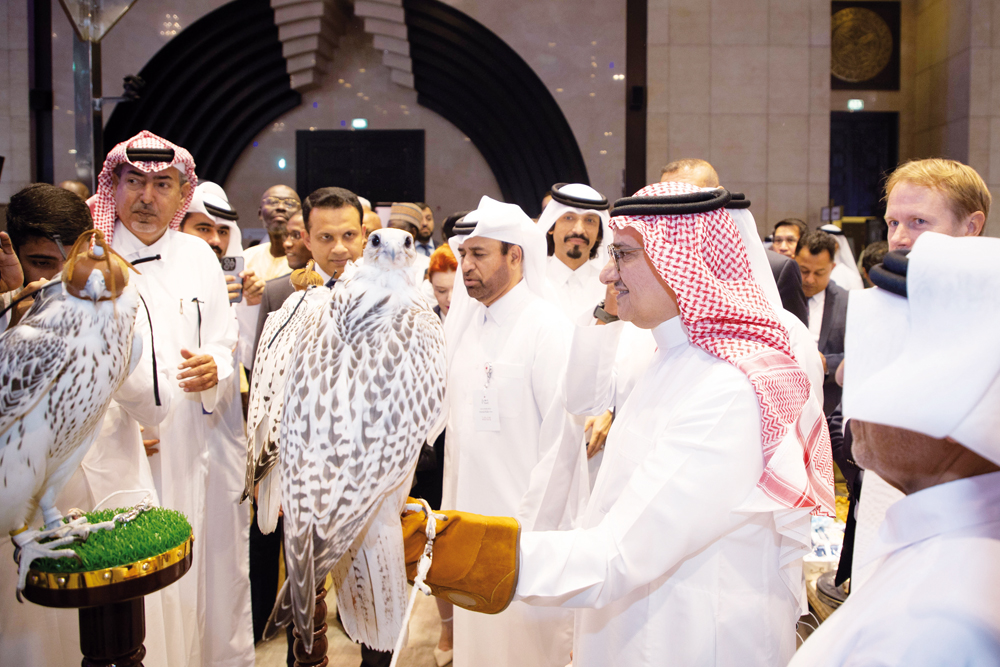 Katara General Manager, Prof. Dr. Khalid bin Ibrahim Al Sulaiti; Saudi Ambassador to Qatar H H Prince Mansour bin Khalid bin Abdullah Al Farhan Al Saud; and others view falcons on display on opening day of the Katara International Hunting and Falcons Exhibition yesterday. 