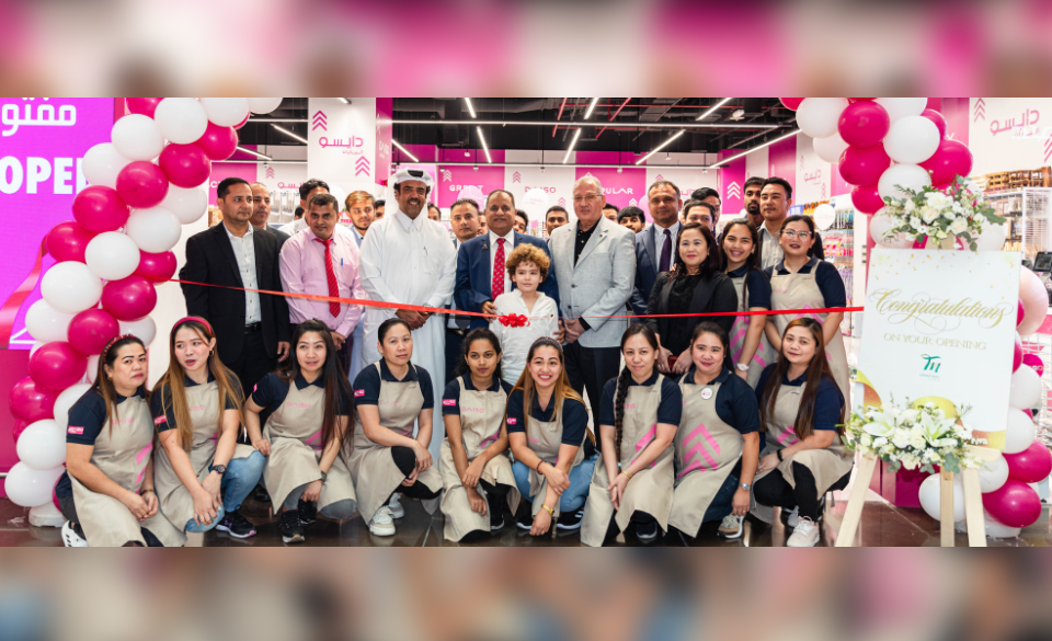 Tawar Mall and Daiso Japan officials with employees during the launch of its 13th branch.