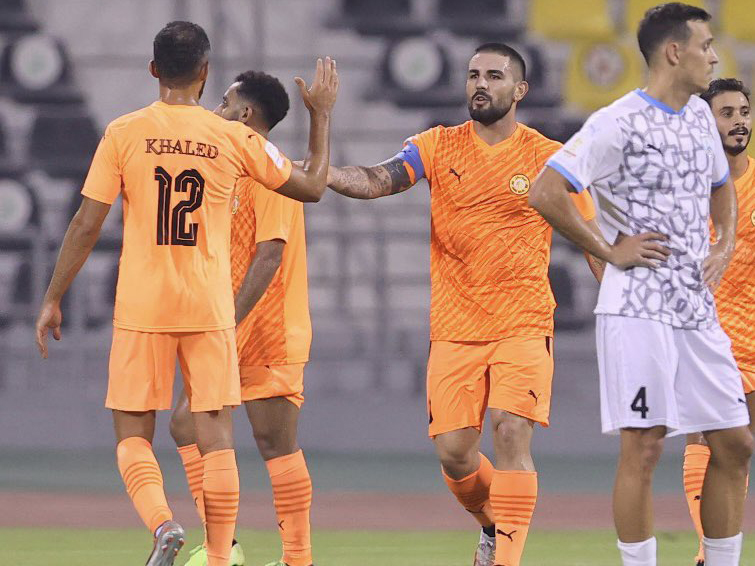 Umm Salal captain Andy Delort (centre) celebrates with teammate Khaled Abdelraouf Alzrigi after the match.