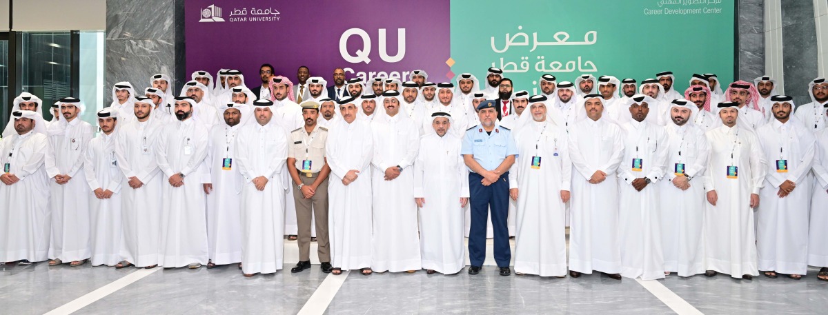 Qatar University President Dr. Omar Al Ansari poses with other officials and students during the opening day of QU Career Fair yesterday.