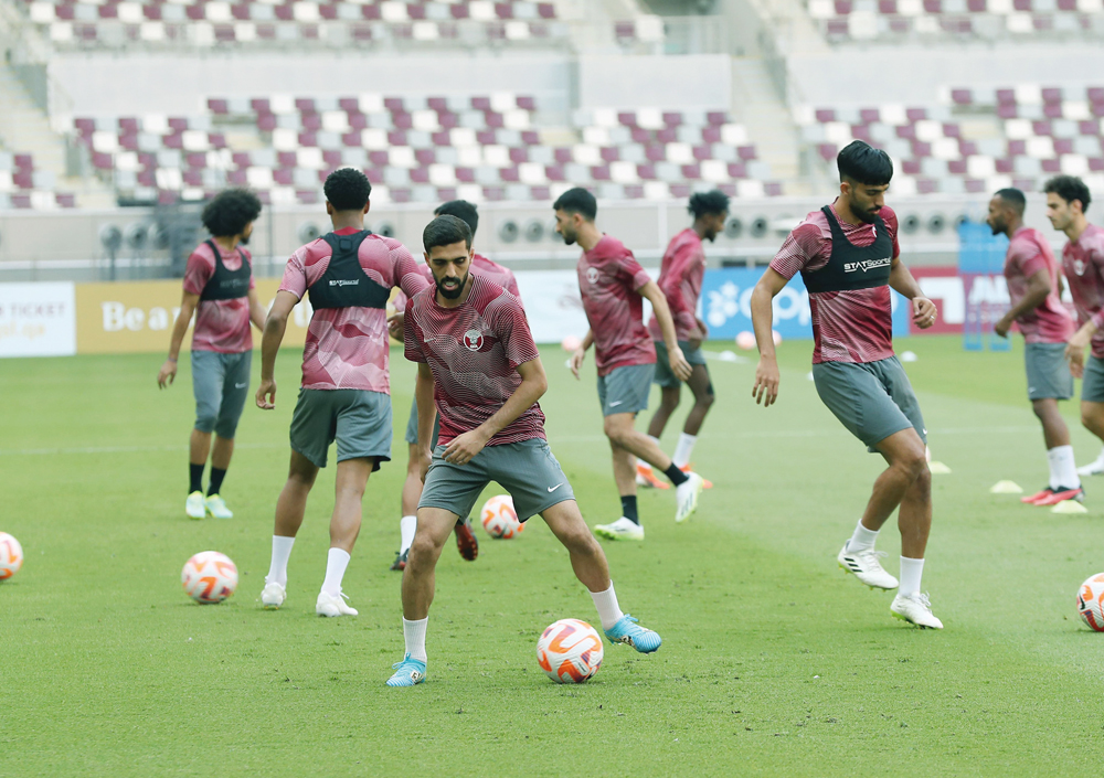 Qatar players in action during a training session at Khalifa International Stadium, yesterday.