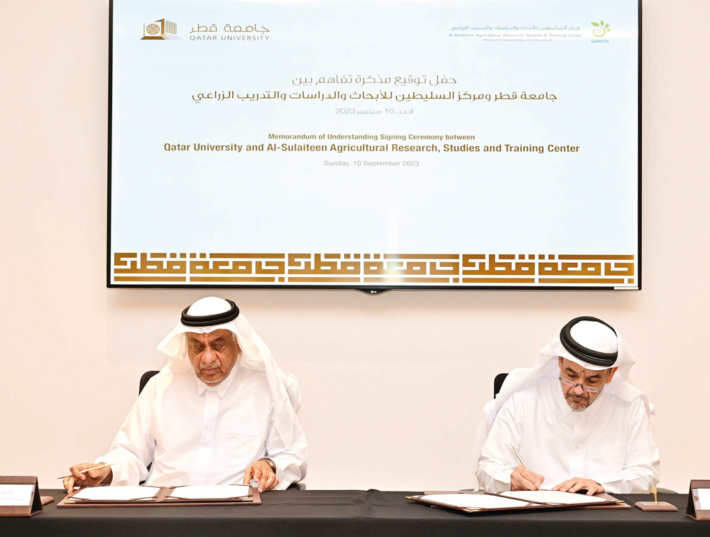 President of QU Dr. Omar Al Ansari and Chairman of the Board of Directors of Al Sulaiteen Centre for Research, Studies, and Agricultural Training, Abdullah Salem Al Sulaiteen, sign the MoU.