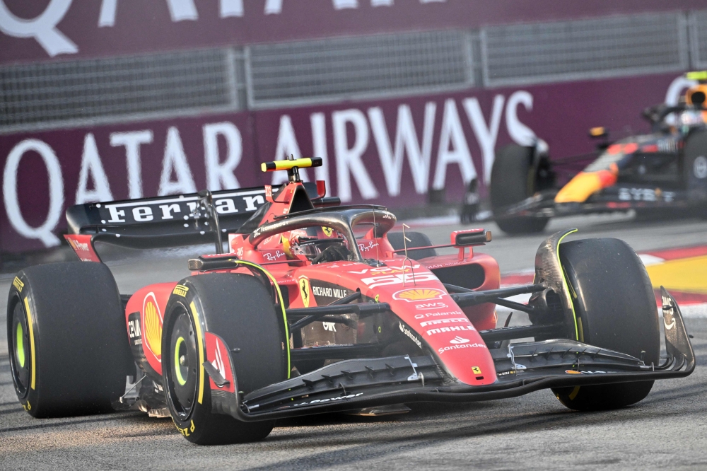 Ferrari's Spanish driver Carlos Sainz Jr drives during the third practice session ahead of the Singapore Formula One Grand Prix night race at the Marina Bay Street Circuit in Singapore on September 16, 2023. (Photo by Roslan Rahman / AFP)