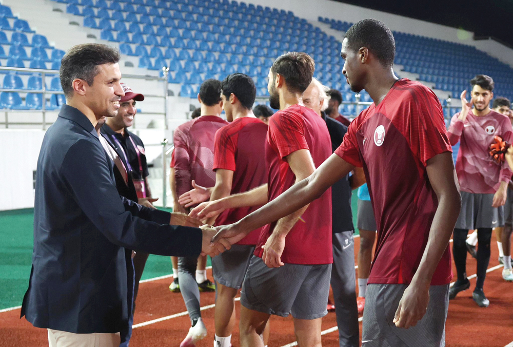 Qatar Olympic Committee Secretary General and Qatar Football Association President Jassim Rashid Al Buenain meets Qatar U23 football squad in Hangzhou yesterday.    