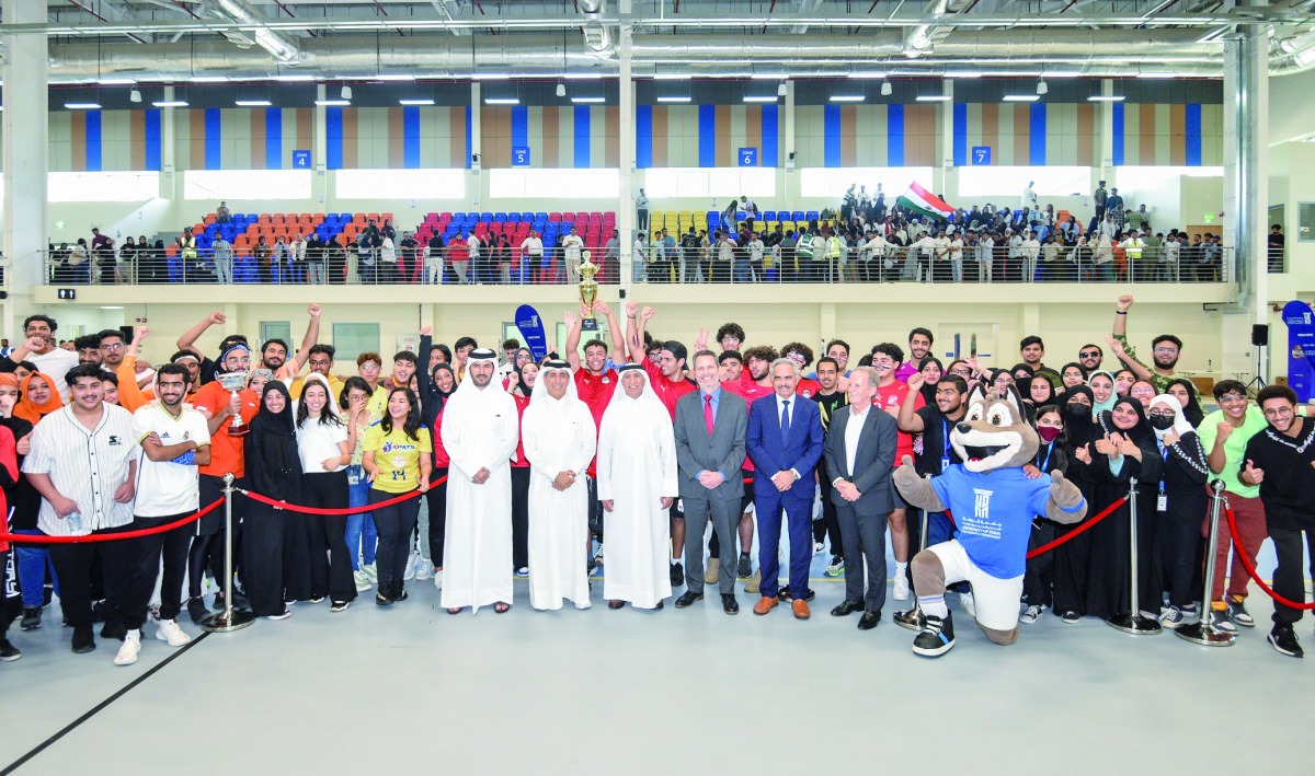 UDST officials with students after the International University Sport Week.