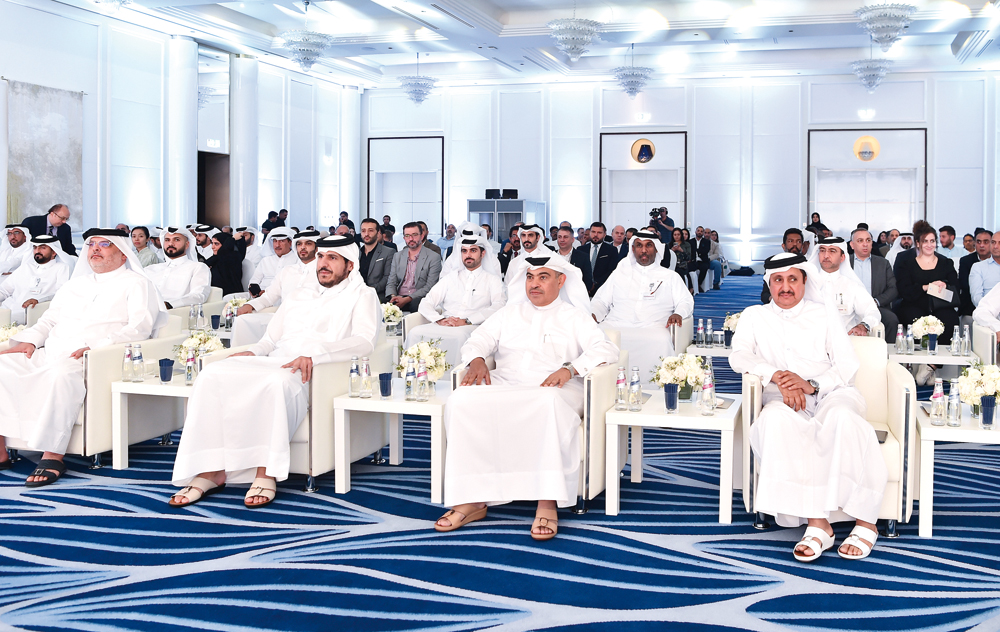 Minister of Finance H E Ali bin Ahmed Al Kuwari (second right), Minister of Commerce and Industry H E Sheikh Mohammed bin Hamad bin Qassim Al Abdullah Al Thani (third right), Chairman of the Board of Directors of the Qatar Chamber, Sheikh Khalifa bin Jassim Al Thani (first right), and President of Ashghal Saad bin Ahmed Al Muhannadi (first left) with other senior officials during inauguration of Government Procurement Forum, yesterday.