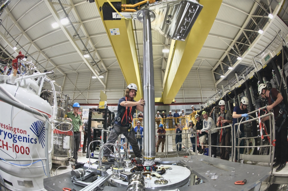 This handout photograph released by CERN on September 27, 2023, shows the insertion of ALPHA-g apparatus at CERN in Geneva on October 15, 2018. (Photo by Handout / CERN / AFP)