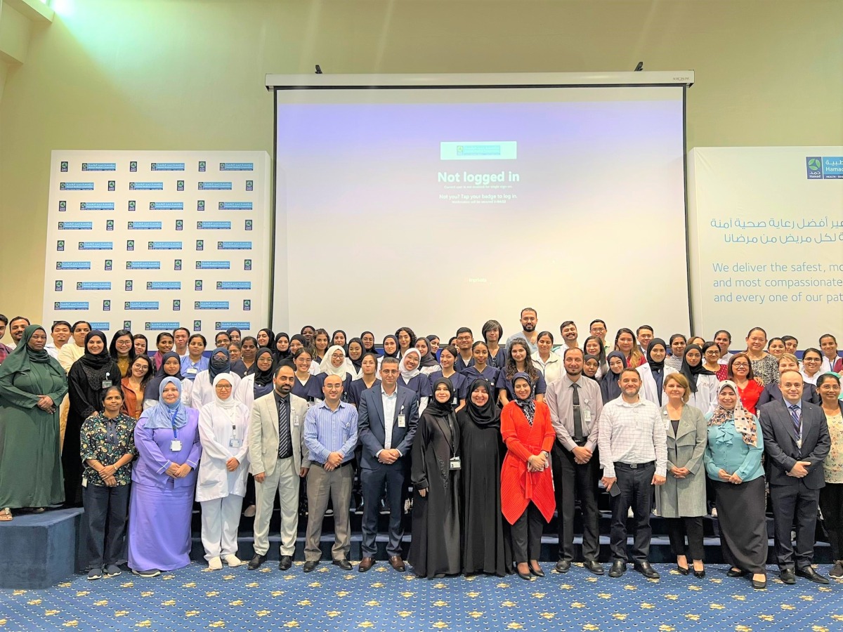 Dr. Nabila Al Meer, Deputy Chief for Continuing Care Group with officials and students. 