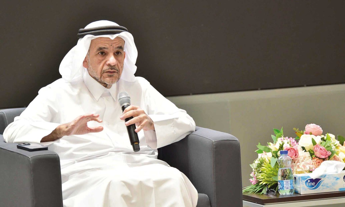 QU President Dr. Omar Al Ansari speaking during an event.