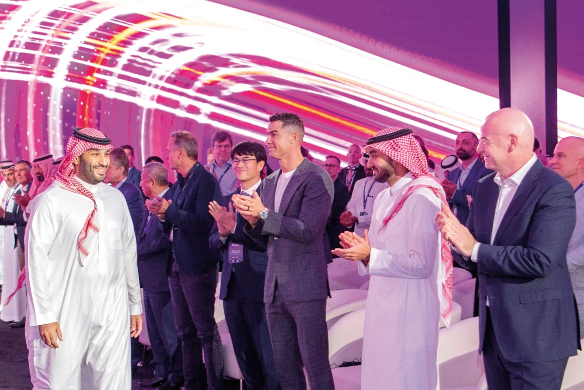 Crown Prince and Prime Minister of the Kingdom of Saudi Arabia, HRH Prince Mohammed bin Salman bin Abdulaziz Al Saud being welcomed by FIFA President Gianni Infantino (right) and Al Nassr’s Portuguese forward Cristiano Ronaldo (centre) at the launch of the eSports World Cup in Riyadh. AFP