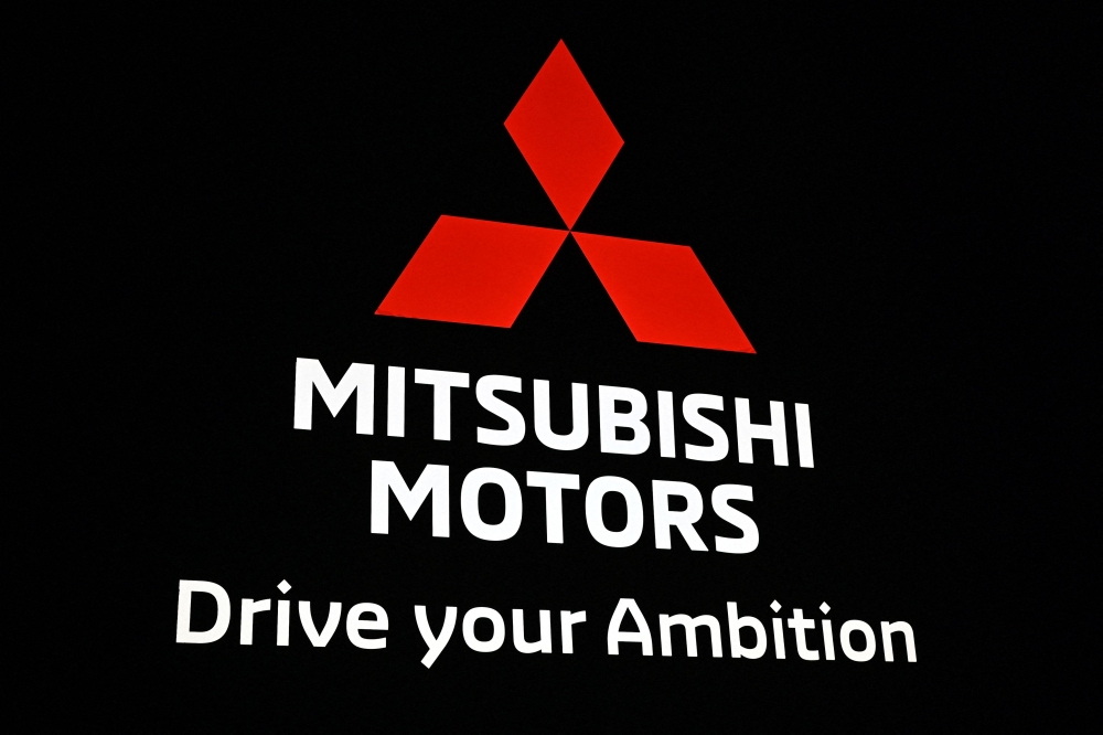 This file picture taken on October 23, 2019 shows the Mitsubishi Motors logo during the Tokyo Motor Show in Tokyo. Photo by Charly TRIBALLEAU / AFP