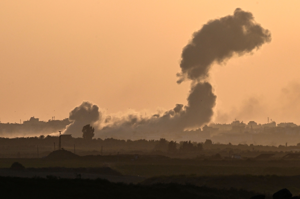 Smoke billowing during Israeli bombardment in the north of the Gaza Strip on October 30, 2023. (Photo by Yuri Cortez / AFP)