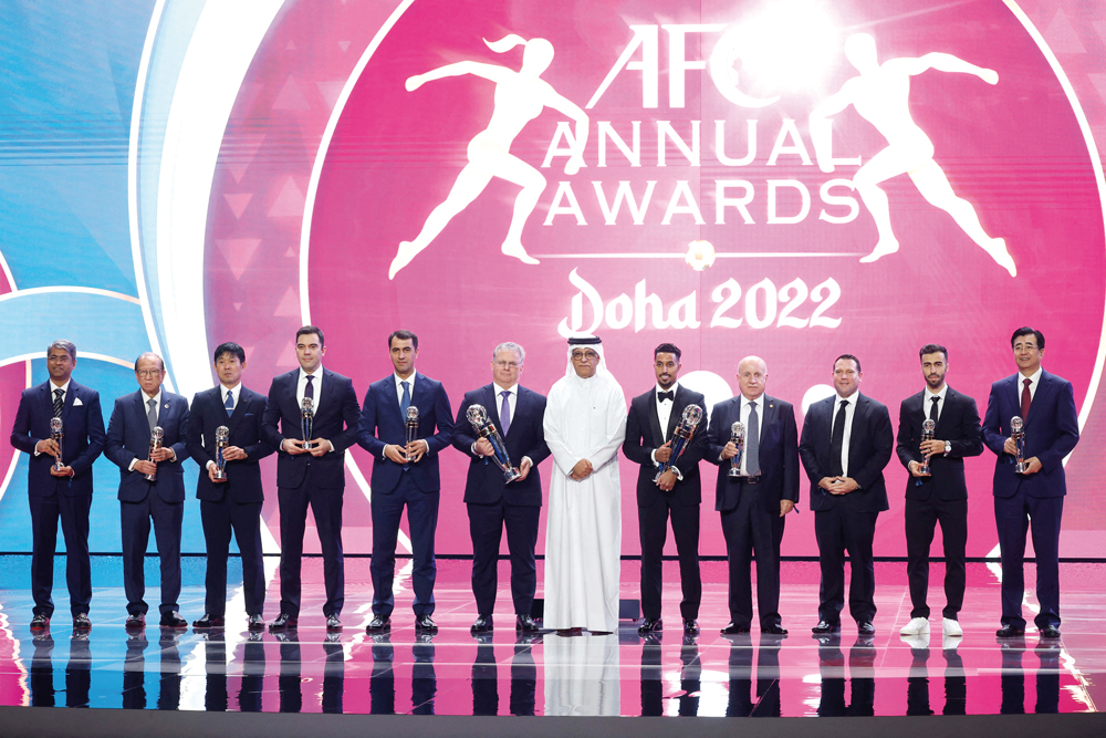 Asian Football Confederation President Shaikh Salman bin Ibrahim Al Khalifa with the award winners during the AFC Annual Awards Doha 2022, yesterday. Pictures: Mohamed Farag