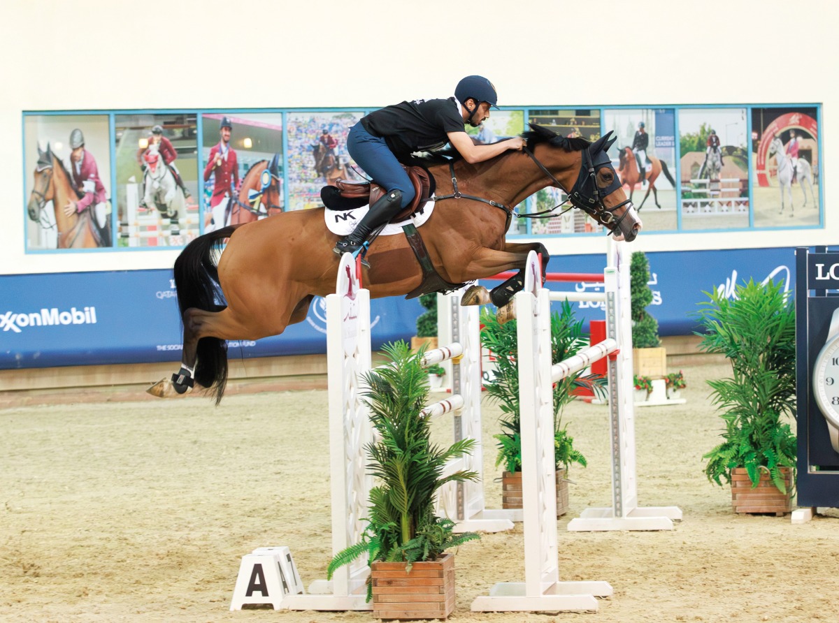 Team NK Cafe's Saeed Nasser Al Qadi guides Carrera Denfer over a fence during the Medium Tour Team event.